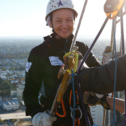 Natalie is all smiles as she prepares to abseil down 40 storeys!